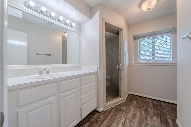 463 Dover Ln, Spring, TX 77373 - full bathroom with vanity, a stall shower, and wood finished floors
