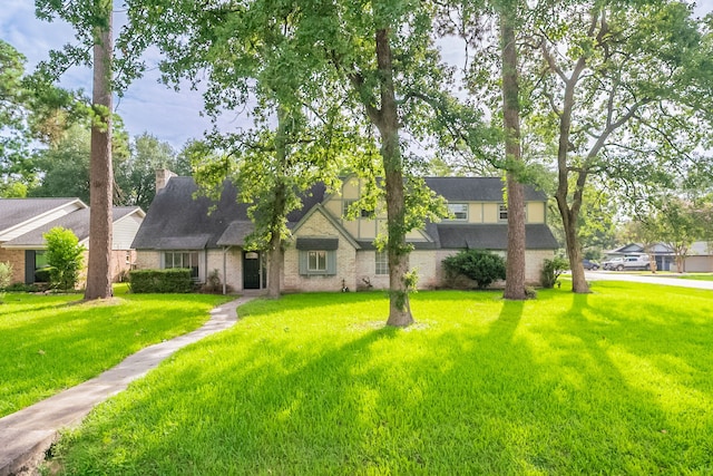 463 Dover Ln, Spring, TX 77373 - view of front of property with a front yard, brick siding, and roof with shingles