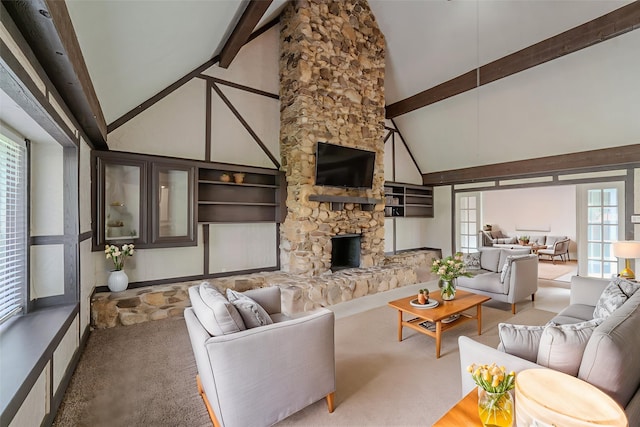 463 Dover Ln, Spring, TX 77373 - carpeted living area with high vaulted ceiling, beamed ceiling, and a fireplace