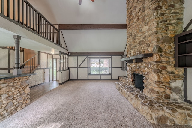 463 Dover Ln, Spring, TX 77373 - unfurnished living room with a high ceiling, a fireplace, ceiling fan, stairway, and carpet floors