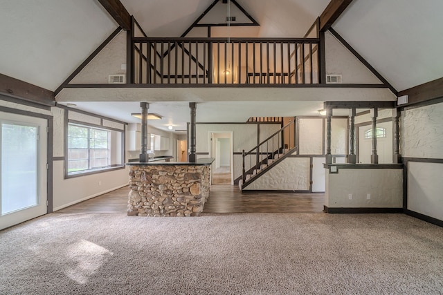 463 Dover Ln, Spring, TX 77373 - unfurnished living room with carpet flooring, high vaulted ceiling, stairs, and ornate columns