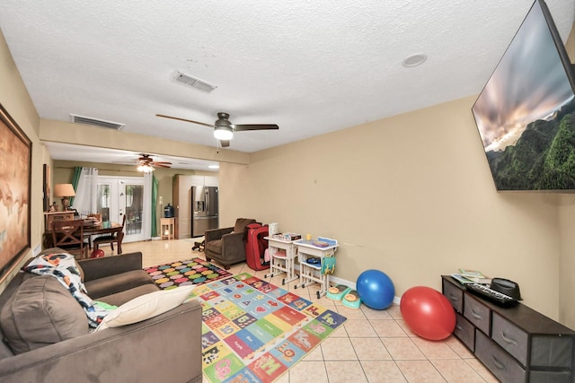 4827 Dalmatian Dr, Houston, TX 77045 - living area featuring a ceiling fan, light tile patterned floors, and a textured ceiling