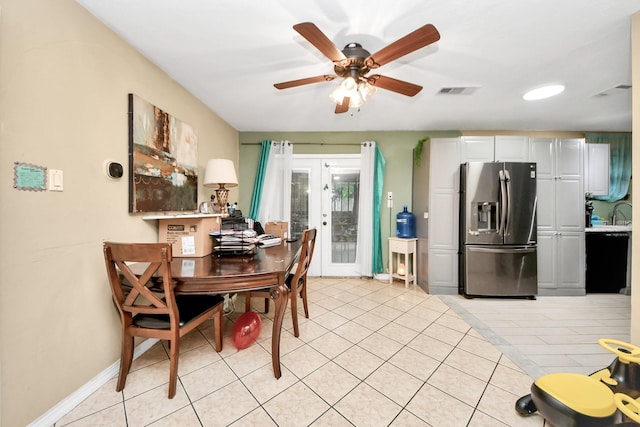 4827 Dalmatian Dr, Houston, TX 77045 - dining area with french doors, ceiling fan, and light tile patterned floors