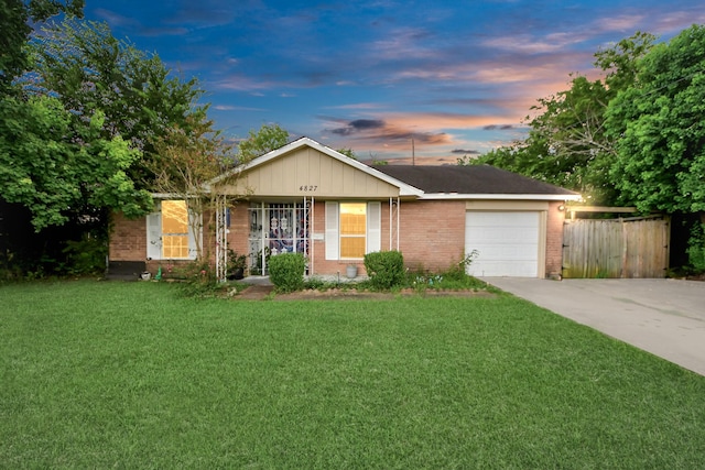 4827 Dalmatian Dr, Houston, TX 77045 - ranch-style home with brick siding, an attached garage, and concrete driveway