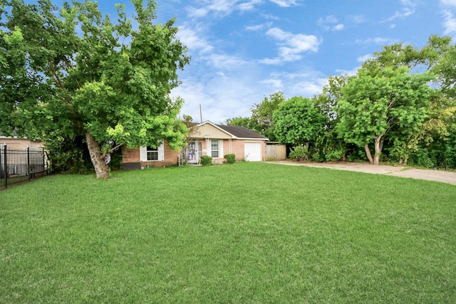 4827 Dalmatian Dr, Houston, TX 77045 - view of front of house with a garage and concrete driveway