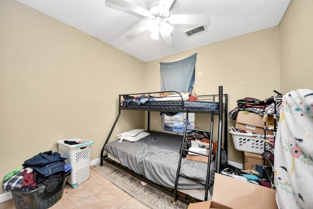 4827 Dalmatian Dr, Houston, TX 77045 - bedroom featuring tile patterned floors and ceiling fan