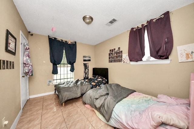 4827 Dalmatian Dr, Houston, TX 77045 - tiled bedroom with baseboards
