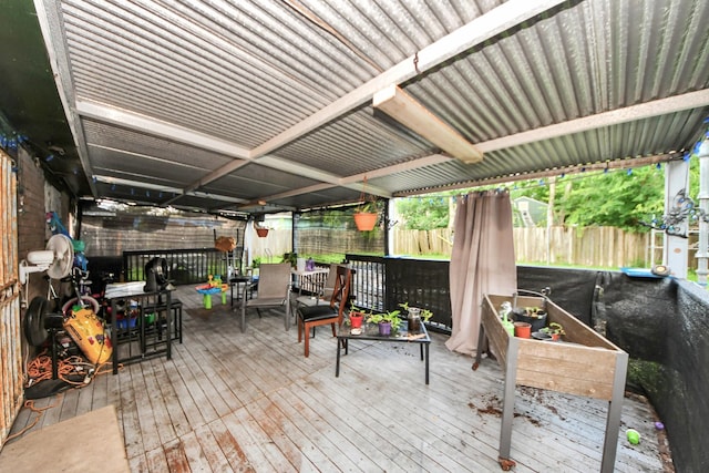 4827 Dalmatian Dr, Houston, TX 77045 - wooden terrace featuring a fenced backyard and outdoor dining space