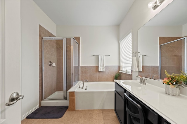 13215 Dover Bluff Dr, Rosharon, TX 77583 - bathroom with vanity, a garden tub, a shower stall, and tile patterned floors