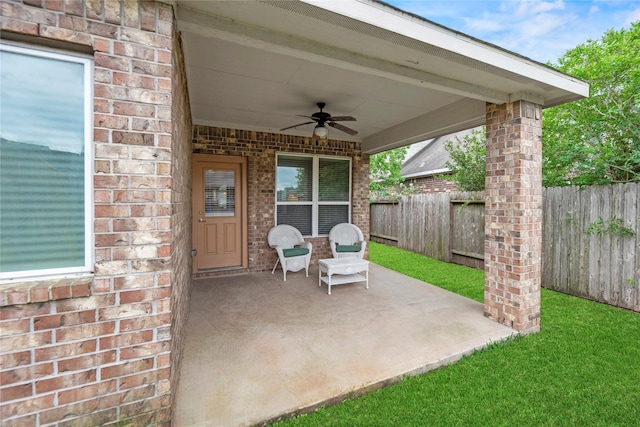 13215 Dover Bluff Dr, Rosharon, TX 77583 - fenced backyard featuring a ceiling fan and a patio area