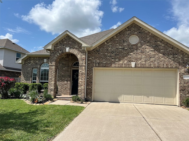 13215 Dover Bluff Dr, Rosharon, TX 77583 - view of front of home featuring driveway, an attached garage, brick siding, and a front yard