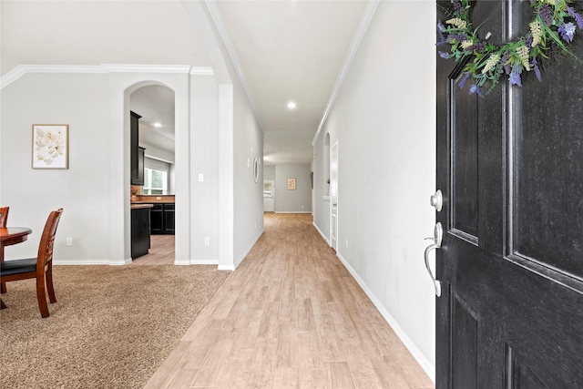 13215 Dover Bluff Dr, Rosharon, TX 77583 - foyer with ornamental molding, light wood-style flooring, recessed lighting, and arched walkways