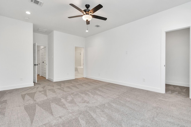 2213 Lee St, Houston, TX 77026 - unfurnished bedroom featuring a walk in closet, carpet flooring, ensuite bath, a ceiling fan, and recessed lighting