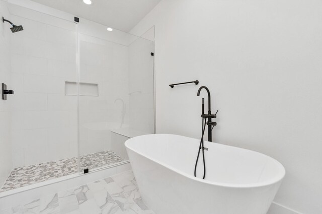 2213 Lee St, Houston, TX 77026 - bathroom with a shower stall, a freestanding bath, recessed lighting, and marble look tile flooring