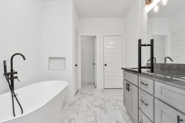 2213 Lee St, Houston, TX 77026 - full bath featuring marble finish flooring, vanity, and a freestanding bath