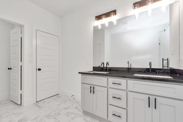 2213 Lee St, Houston, TX 77026 - full bath with marble look tile flooring and double vanity