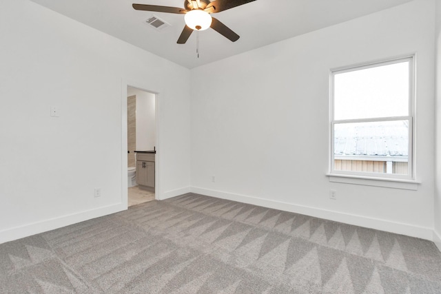 2213 Lee St, Houston, TX 77026 - spare room with light colored carpet and a ceiling fan