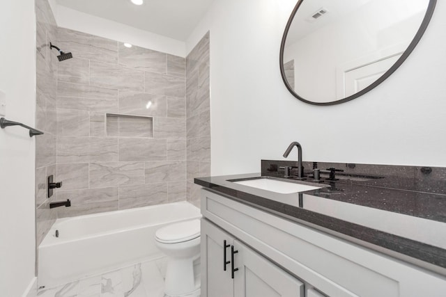 2213 Lee St, Houston, TX 77026 - full bathroom with vanity,  shower combination, marble look tiles, and recessed lighting