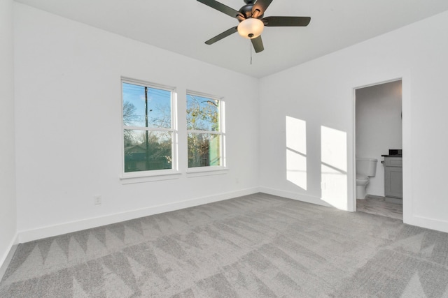 2213 Lee St, Houston, TX 77026 - carpeted spare room with a ceiling fan and baseboards