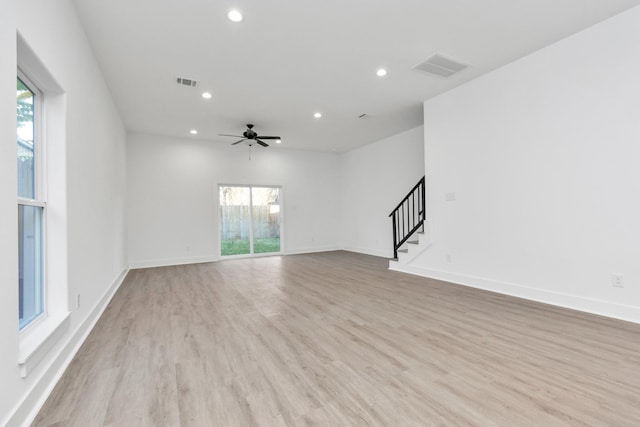 2213 Lee St, Houston, TX 77026 - unfurnished living room featuring stairs, ceiling fan, recessed lighting, and light wood-style flooring