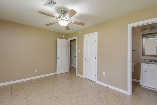 1011 Minnesota St, South Houston, TX 77587 - unfurnished bedroom featuring light tile patterned floors, a ceiling fan, and a closet