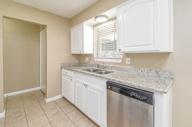 1011 Minnesota St, South Houston, TX 77587 - kitchen with dishwasher, white cabinetry, light tile patterned flooring, and light stone counters