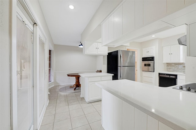 9306 Claridge Dr, Houston, TX 77031 - kitchen featuring black appliances, a peninsula, light tile patterned flooring, range hood, and recessed lighting