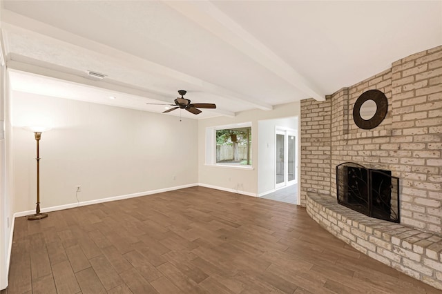 9306 Claridge Dr, Houston, TX 77031 - unfurnished living room with a fireplace, ceiling fan, wood finished floors, and beamed ceiling