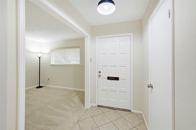 9306 Claridge Dr, Houston, TX 77031 - foyer entrance featuring baseboards and light carpet