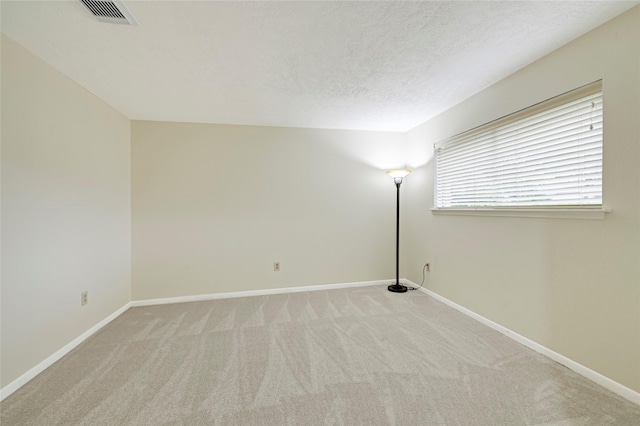 9306 Claridge Dr, Houston, TX 77031 - carpeted spare room with baseboards and a textured ceiling