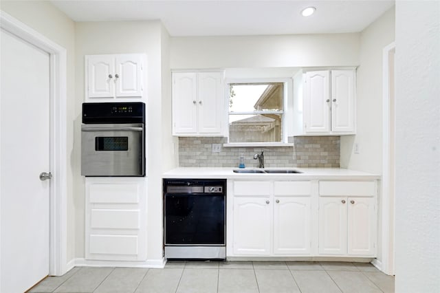 9306 Claridge Dr, Houston, TX 77031 - kitchen featuring oven, black dishwasher, white cabinetry, tasteful backsplash, and recessed lighting