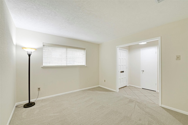 9306 Claridge Dr, Houston, TX 77031 - spare room featuring carpet floors and a textured ceiling