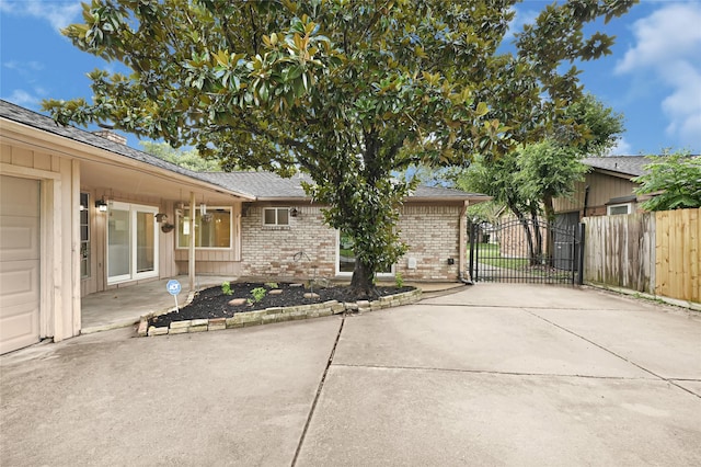 9306 Claridge Dr, Houston, TX 77031 - view of patio featuring a gate and concrete driveway