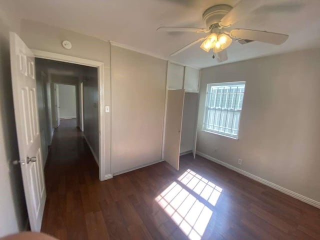 5131 Nassau Rd, Houston, TX 77021 - unfurnished bedroom with dark wood finished floors, ceiling fan, and a closet