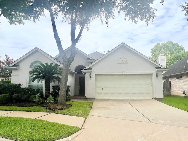 1150 Sienna Hill Dr, Houston, TX 77077 - view of front of house with stucco siding, driveway, and an attached garage