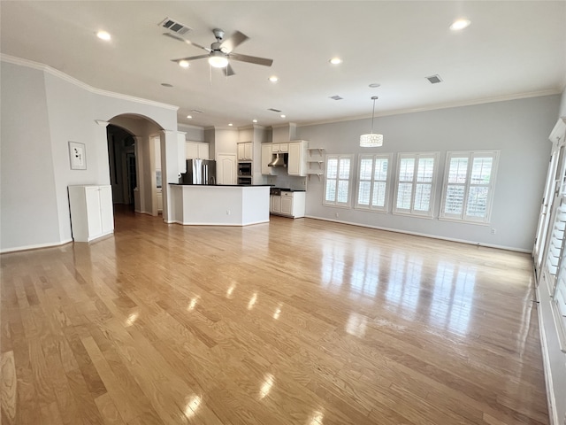 1150 Sienna Hill Dr, Houston, TX 77077 - unfurnished living room with ceiling fan, arched walkways, crown molding, recessed lighting, and light wood-style flooring