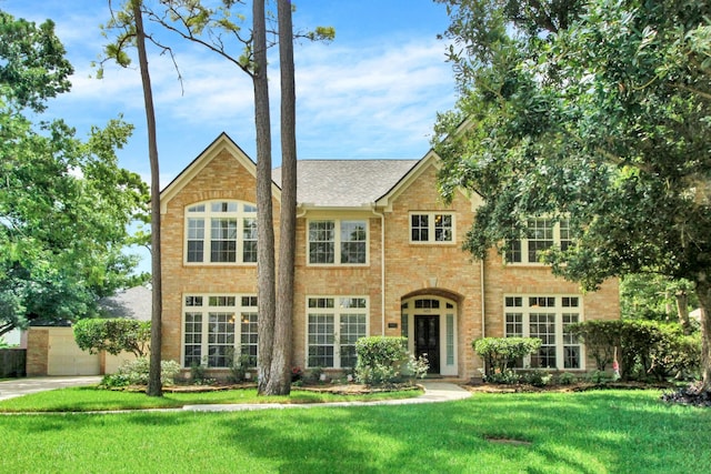 603 Forest Bend Ln, Friendswood, TX 77546 - view of front of house with a front lawn and brick siding