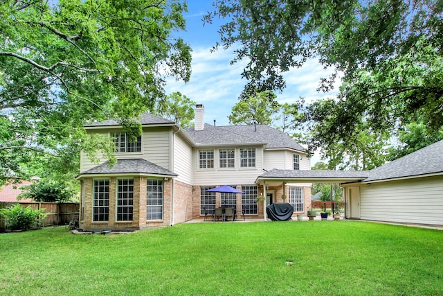 603 Forest Bend Ln, Friendswood, TX 77546 - back of property with brick siding, a chimney, a patio area, and a shingled roof
