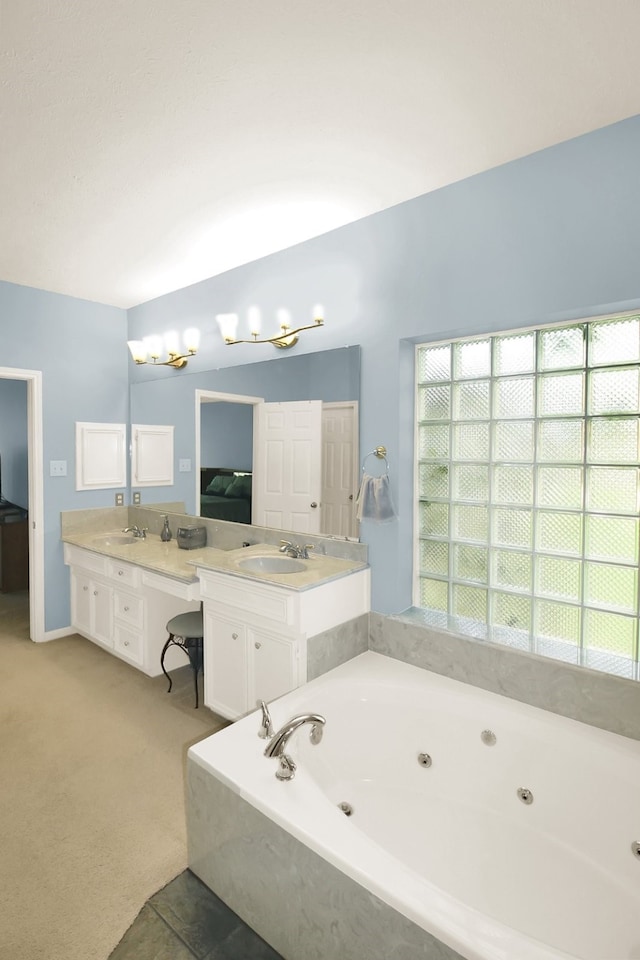 603 Forest Bend Ln, Friendswood, TX 77546 - full bathroom featuring a tub with jets and double vanity