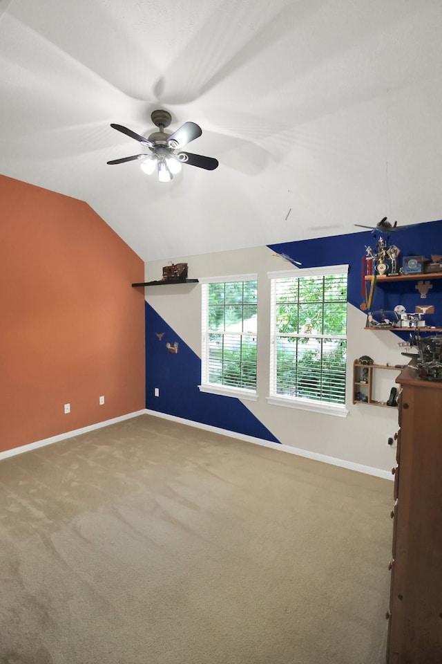 603 Forest Bend Ln, Friendswood, TX 77546 - unfurnished living room featuring vaulted ceiling, carpet floors, and a ceiling fan
