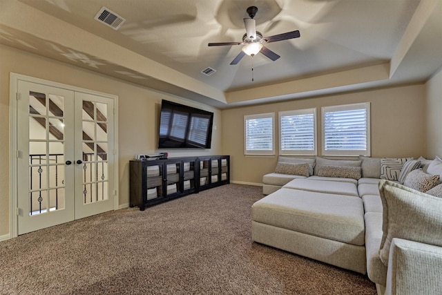 9714 Luna Springs Ln, Cypress, TX 77433 - living room featuring a raised ceiling, french doors, carpet flooring, and ceiling fan