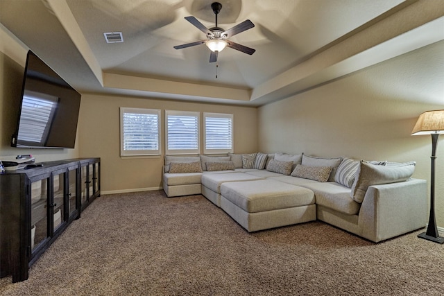 9714 Luna Springs Ln, Cypress, TX 77433 - carpeted living room with a tray ceiling and ceiling fan