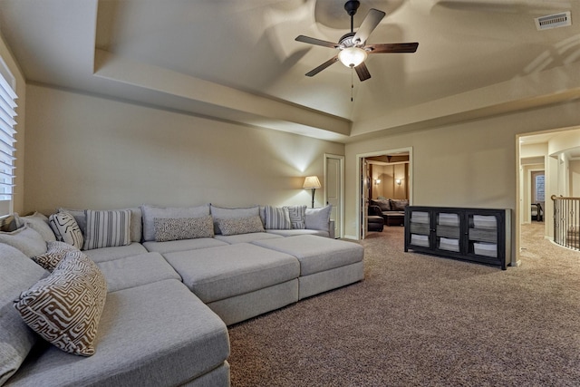 9714 Luna Springs Ln, Cypress, TX 77433 - living room featuring a ceiling fan, carpet, and a tray ceiling