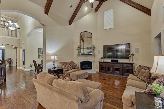 9714 Luna Springs Ln, Cypress, TX 77433 - living room with high vaulted ceiling, arched walkways, ceiling fan, beam ceiling, and wood finished floors