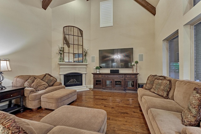 9714 Luna Springs Ln, Cypress, TX 77433 - living area with high vaulted ceiling, wood finished floors, beam ceiling, and a fireplace with raised hearth