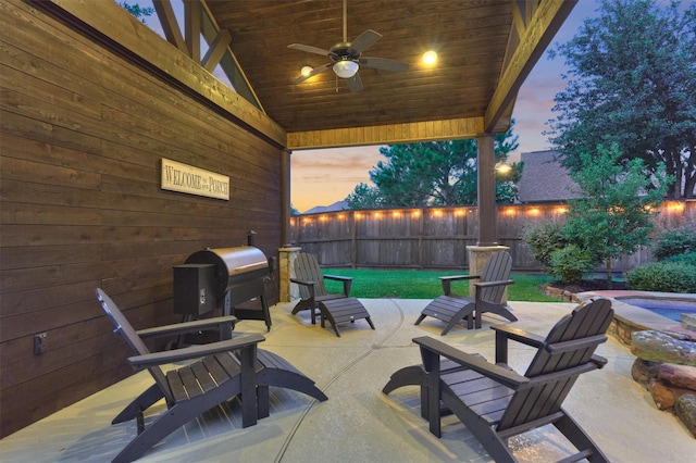 9714 Luna Springs Ln, Cypress, TX 77433 - fenced backyard featuring a patio, a ceiling fan, and grilling area