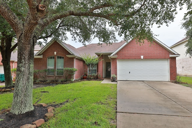30515 Red Bluff Cir, Magnolia, TX 77355 - ranch-style house with an attached garage, concrete driveway, a front yard, brick siding, and a shingled roof
