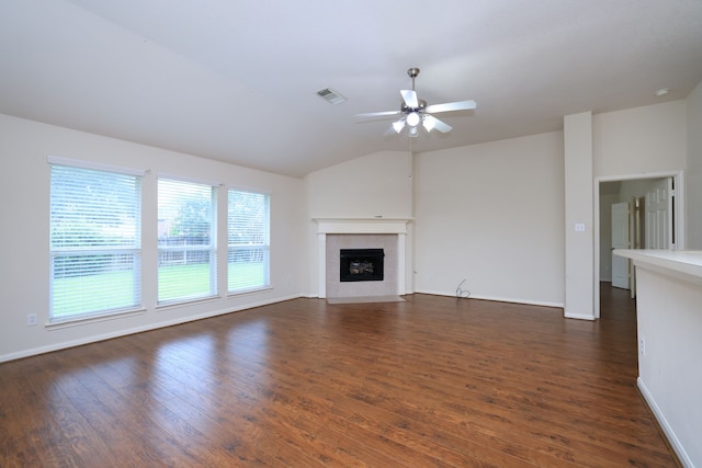 30515 Red Bluff Cir, Magnolia, TX 77355 - unfurnished living room featuring ceiling fan, dark wood-style floors, a tile fireplace, and lofted ceiling