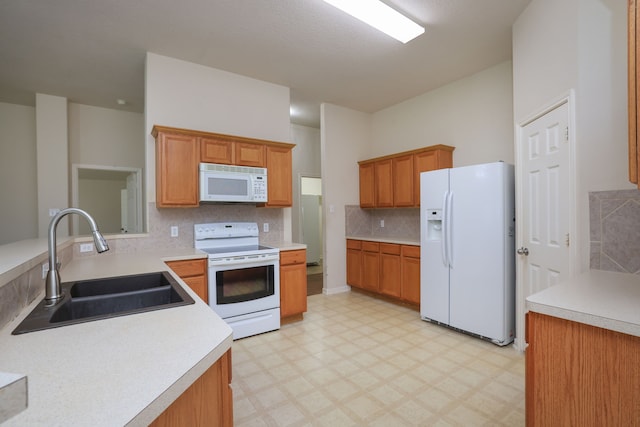 30515 Red Bluff Cir, Magnolia, TX 77355 - kitchen featuring white appliances, decorative backsplash, light floors, and light countertops
