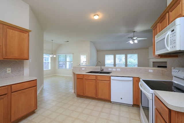 30515 Red Bluff Cir, Magnolia, TX 77355 - kitchen with white appliances, a ceiling fan, lofted ceiling, backsplash, and light flooring